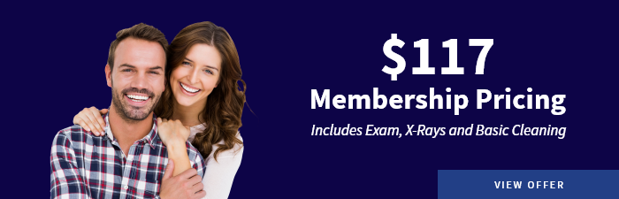 Smiling man in sweater and sunglasses