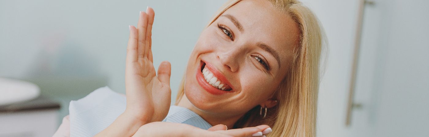 Happy cosmetic dentistry patient showing off her smile