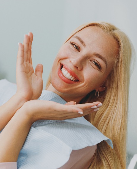 Happy cosmetic dentistry patient showing off her smile