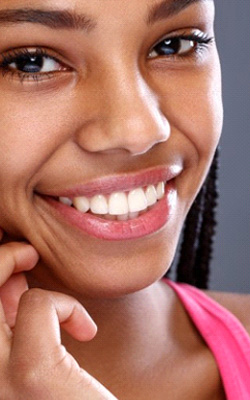 a woman smiling with straight teeth